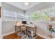 Bright home office with modern desk and a ceiling fan at 2180 7Th Ave N, St Petersburg, FL 33713
