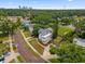 An aerial view of a charming home nestled among lush greenery in a beautiful neighborhood at 2306 Trelain S Dr, St Petersburg, FL 33712
