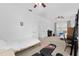 Bedroom featuring multiple beds and ceiling fans with carpeted flooring, creating a versatile and comfortable space at 2306 Trelain S Dr, St Petersburg, FL 33712