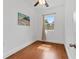 Cozy bedroom features hardwood floors and a beach scene wall art at 2306 Trelain S Dr, St Petersburg, FL 33712