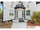 Close up of front entrance with a decorative iron gate and black and white trim at 2306 Trelain S Dr, St Petersburg, FL 33712