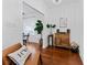 Hallway featuring hardwood floors and view into the dining room at 2306 Trelain S Dr, St Petersburg, FL 33712