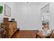 Hallway featuring hardwood floors and view into the living room at 2306 Trelain S Dr, St Petersburg, FL 33712
