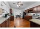 Modern kitchen featuring stainless steel appliances, granite countertops, and a view into the dining room at 2306 Trelain S Dr, St Petersburg, FL 33712