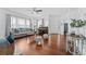 Bright living room features hardwood floors, neutral décor, and a decorative entry door at 2306 Trelain S Dr, St Petersburg, FL 33712