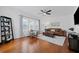 Living room with hardwood floors features a comfortable seating area and natural light at 2306 Trelain S Dr, St Petersburg, FL 33712