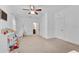 ' playroom with carpeted floor, ceiling fan, and multiple closets at 2306 Trelain S Dr, St Petersburg, FL 33712
