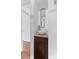 Powder room features bowl sink on granite countertop and wood cabinet at 2306 Trelain S Dr, St Petersburg, FL 33712