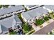An aerial view shows the townhome complex with manicured lawns and ample parking at 26610 Castleview Way, Wesley Chapel, FL 33544