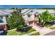 Inviting townhome with manicured lawn, two-car garage and neat landscaping enhances curb appeal at 26610 Castleview Way, Wesley Chapel, FL 33544