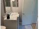 Bathroom vanity with a marble countertop and decorative mirror at 2720 Sand Hollow Ct # 156A, Clearwater, FL 33761