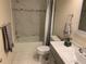 A renovated bathroom with white tile, a shower-tub combo, and modern fixtures at 2720 Sand Hollow Ct # 156A, Clearwater, FL 33761