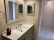 Bathroom vanity featuring a decorative mirror and modern fixtures at 2720 Sand Hollow Ct # 156A, Clearwater, FL 33761