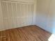 Bedroom features laminate wood flooring and ample closet space at 2720 Sand Hollow Ct # 156A, Clearwater, FL 33761