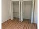 Bedroom closet with bifold doors and ample space at 2720 Sand Hollow Ct # 156A, Clearwater, FL 33761