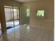 The dining area has tile floors and sliding doors to a private patio at 2720 Sand Hollow Ct # 156A, Clearwater, FL 33761