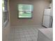 Bright area with a window and modern refrigerator at 2720 Sand Hollow Ct # 156A, Clearwater, FL 33761