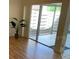A living room features sliding glass doors to a private patio at 2720 Sand Hollow Ct # 156A, Clearwater, FL 33761