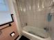 Enclosed bathtub with tiled walls and clear shower curtain at 2900 Dr Martin Luther King Jr S St, St Petersburg, FL 33705