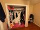 Walk-in closet with clothes, shelving, and a pink rug, providing ample storage space at 2900 Dr Martin Luther King Jr S St, St Petersburg, FL 33705