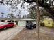 Modest single-story home with a metal roof, small front yard, and a compact driveway for two cars at 2900 Dr Martin Luther King Jr S St, St Petersburg, FL 33705