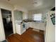 The kitchen has essential appliances and an adjacent view of the bedroom at 2900 Dr Martin Luther King Jr S St, St Petersburg, FL 33705