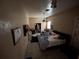 Bedroom with ceiling fan, tile flooring, closet access, and minimal decor at 2900 Dr Martin Luther King Jr S St, St Petersburg, FL 33705