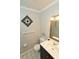 Cozy half-bathroom with decorative mirror and updated fixtures at 300 6Th N St # E3, Safety Harbor, FL 34695