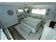 Cozy bedroom features a queen-sized bed, mirrored closet, and a ceiling fan at 300 6Th N St # E3, Safety Harbor, FL 34695