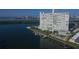 Waterfront condominium building with boat slips, a pool, and stunning views of the bay and surrounding area at 31 Island Way # 1403, Clearwater Beach, FL 33767
