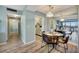 Bright dining area with modern furnishings and a view into the kitchen at 31 Island Way # 1403, Clearwater Beach, FL 33767