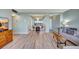 Open living space with wood floors connects the living and dining areas at 31 Island Way # 1403, Clearwater Beach, FL 33767