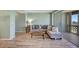 Comfortable living room with stylish sofa, wooden floor, and sliding glass doors at 31 Island Way # 1403, Clearwater Beach, FL 33767