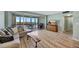 Spacious living room with comfortable seating, TV, and access to a screened-in porch at 31 Island Way # 1403, Clearwater Beach, FL 33767