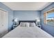 Cozy main bedroom with a queen bed, matching side tables, and stunning water views at 31 Island Way # 1403, Clearwater Beach, FL 33767