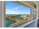 Stunning water view through a large window, showcasing the city skyline and waterways at 31 Island Way # 1403, Clearwater Beach, FL 33767