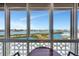 Panoramic water and city views through large windows provide a beautiful backdrop for dining at 31 Island Way # 1403, Clearwater Beach, FL 33767