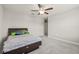 Comfortable bedroom with plush carpet, ceiling fan, and a serene ambiance at 3212 Calvano Dr, Land O Lakes, FL 34639