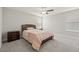 Bedroom featuring neutral walls, gray carpet, ceiling fan, and wood furniture at 3212 Calvano Dr, Land O Lakes, FL 34639