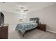 Bedroom featuring neutral walls, gray carpet, ceiling fan, and wood furniture at 3212 Calvano Dr, Land O Lakes, FL 34639