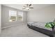 Cozy bedroom with carpet, natural light, and a ceiling fan at 3212 Calvano Dr, Land O Lakes, FL 34639