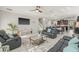 Open-concept living area with ample natural light, modern decor, an eat-in kitchen, and comfortable seating at 3212 Calvano Dr, Land O Lakes, FL 34639