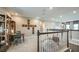 View of the large, open loft with desk space and cushioned seating at 33626 Castaway Loop, Wesley Chapel, FL 33543