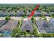 Residential neighborhood featuring well-maintained homes, mature trees, and manicured lawns at 3643 Arbor Chase Dr, Palm Harbor, FL 34683