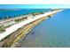 Scenic view of the beach, palm trees, and the ocean at 3643 Arbor Chase Dr, Palm Harbor, FL 34683