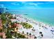 Expansive Clearwater beach featuring pristine white sands and inviting turquoise waters offers the ultimate coastal living experience at 3643 Arbor Chase Dr, Palm Harbor, FL 34683