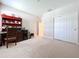 Bedroom with carpet, closet, and work space at 3643 Arbor Chase Dr, Palm Harbor, FL 34683