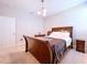 Comfortable bedroom with a sleigh bed, neutral walls, and natural light at 3643 Arbor Chase Dr, Palm Harbor, FL 34683