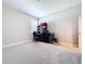 Neutral bedroom with a work space, carpeted floors and door on the right at 3643 Arbor Chase Dr, Palm Harbor, FL 34683
