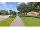 Arbor Chase gated community entrance, featuring well-maintained landscaping and signage at 3643 Arbor Chase Dr, Palm Harbor, FL 34683